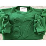 Green embossed crewneck sweatshirt with ribbed collar and cuffs