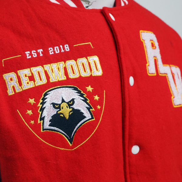 Embroidered logo on red varsity jacket