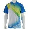 A mannequin displaying a short-sleeved polo shirt with a blue, green, and white abstract wave-like design