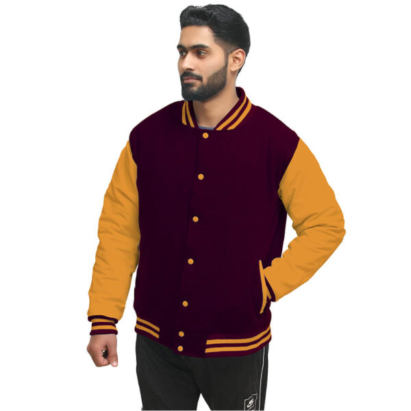 A guy wearing wool and bright gold sleeves maroon letterman jacket