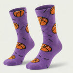 Purple basketball socks with orange basketball ball pattern and black motion lines printed