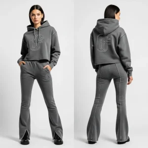 A full vintage-style acid-wash gray sweatsuit with a cropped hoodie and flared trousers with slit cuffs, featuring bold "OF" logos on the front and back of the top.