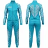 Full-body image showing the aqua blue Angels tracksuit, which features white feather wing designs down the sleeves and pants, plus a prominent wing graphic on the back of the jacket.
