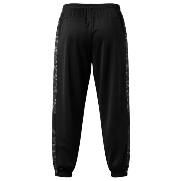 Back view of the black athletic pants detailing the dark gray and black geometric side panel pattern that runs from the hip to the ribbed cuff.