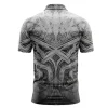 Back view of a gray and black polo shirt with a symmetrical, gritty gothic-style pattern.