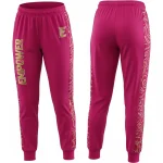 Front and back of hot pink athletic pants with elastic cuffs, featuring gold "EMPOWER" text and a matching gold swirl design on the side panels.