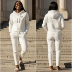 Full product display showing the front and back of a luxurious ivory bride sweatsuit, featuring a front ring graphic and rear 'Bride' script.