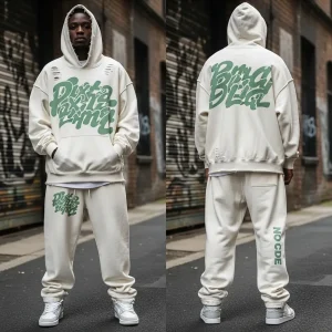 An off-white distressed streetwear set (hoodie and baggy pants), with a textured green puff print design on the front and back of the top.