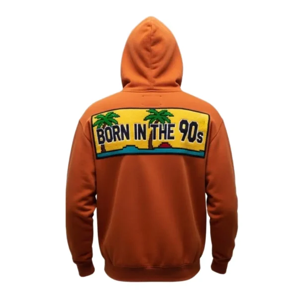 Rear of the hoodie, showcasing a large, colorful embroidered patch on the back with a palm tree and the text 'BORN IN THE 90s'.