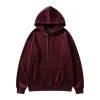 A luxurious, oversized pullover hoodie in a deep maroon or burgundy velour fabric. The front features a soft, plush texture, a drawstring hood, and a large kangaroo pocket.