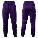 Front and back of purple athletic pants designed for cheer or team wear, highlighted by bold, electric yellow splash and streak patterns on the sides.