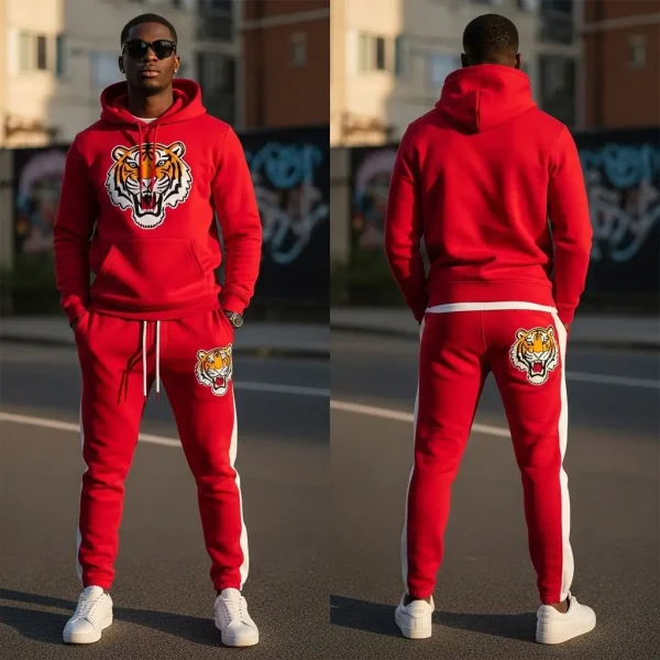 A bold red tracksuit featuring a hoodie and matching pants with white side stripes, embellished with chenille embroidered tiger graphics on the chest and the back of the joggers.