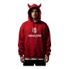 Oversized red hoodie with a playful, built-in devil horn design on the hood. The chest features a bold, white graphic logo above the text "URBAN LEGEND."