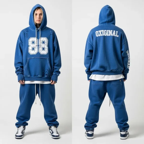 An oversized royal blue fleece tracksuit with a faded wash and distressed tears, featuring a bold "88" number graphic on the front of the top.
