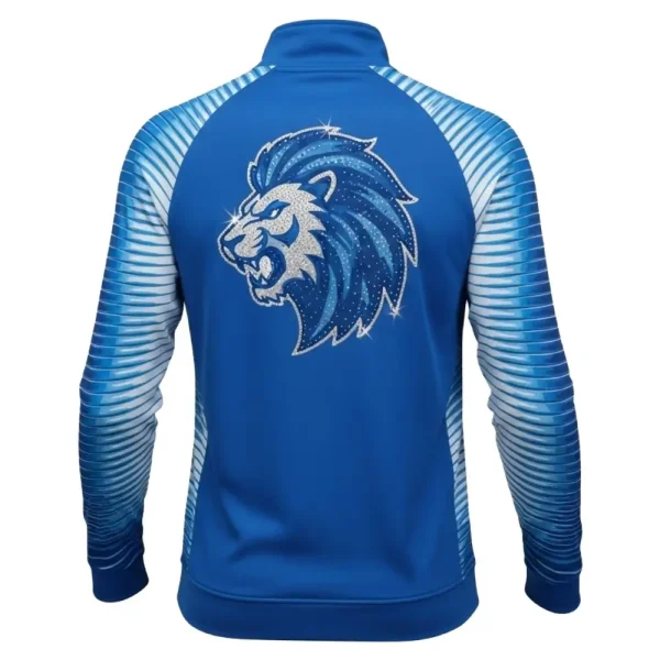 Back view of the royal blue warm-up jacket featuring a large, fierce lion head design on the upper back, intricately detailed with sparkling silver and blue rhinestones.