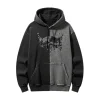 Front of a two-tone black and dark grey pullover hoodie with a contrasting split design, featuring a partial abstract splatter graphic on the chest.