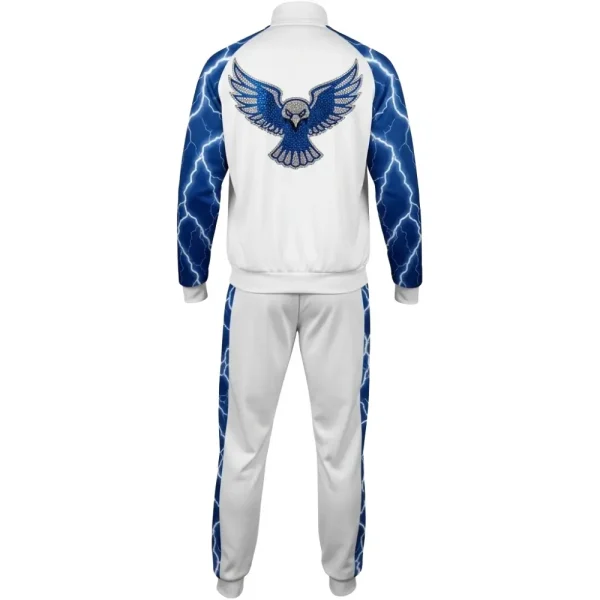 Back view of the white tracksuit jacket, showcasing a large, striking blue hawk or eagle design on the back, intricately detailed with bright blue rhinestones.