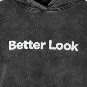 Closeup of custom stone washed hoodie with puff print text "Better Look"