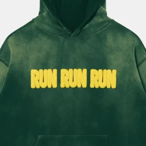 Closeup of custom sun-fade hoodie with puff print text "RUN RUN RUN"