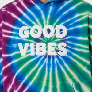 Closeup of custom tie-dye hoodie with puff print text "GOOD VIBES"