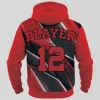 Back view of a custom red and black basketball hoodie displaying "PLAYER 12" over a sharp shard pattern.