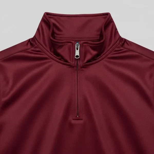 Maroon quarter-zip track jacket closeup.