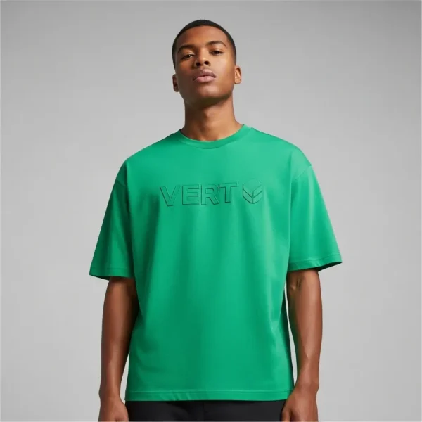 A man wearing boxy fit green embossed t-shirt.