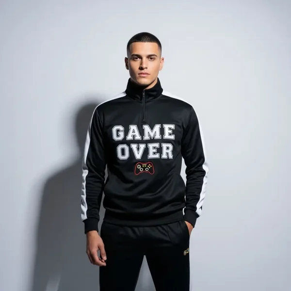Custom black tracksuit with white arms paneling and "GAME OVER" with game controller logo screen printed on it.