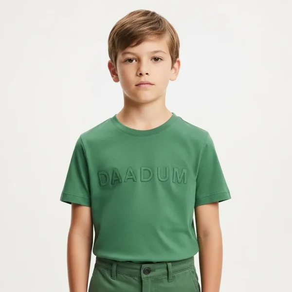 A child wearing green embossed t-shirt.