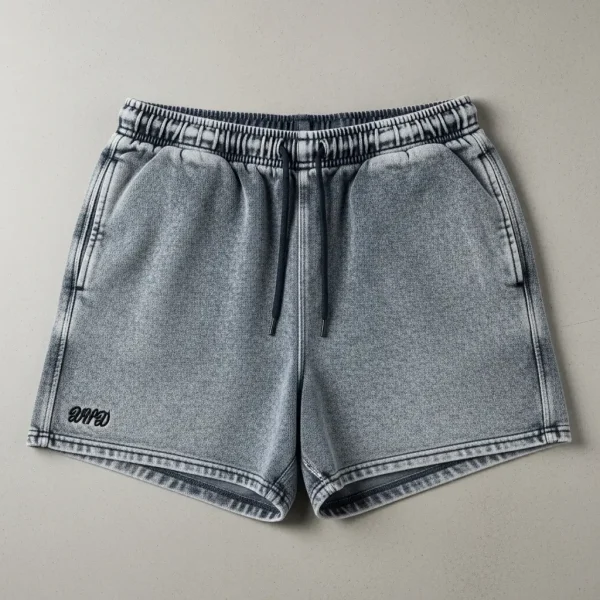 Dark gray sweat shorts with a heavy stone-washed acid wash effect.