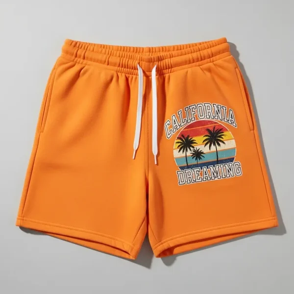 Bold orange sweat shorts featuring a sharp, heat-transferred DTF graphic design.