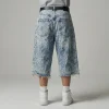 Back view of oversized denim jorts featuring a heavy acid wash finish and a relaxed, baggy fit.