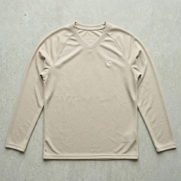 Beige raglan sleeves dri fit shirt.