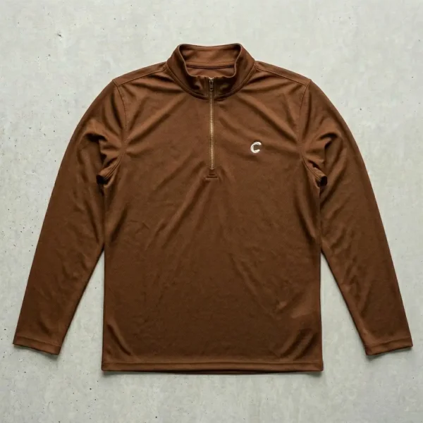 Brown quarter zip dri fit shirt.