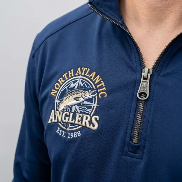 Embroidered men's quarter zip offshore fishing shirt closeup.