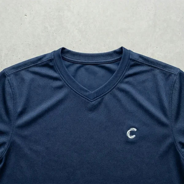 Navy blue v neck dri fit shirt.