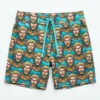 All over aquaman face printed board shorts front.