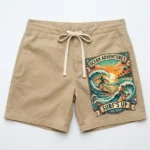Beige ocean adventures dtf printed board shorts front.