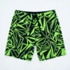 Black and neon green crossfit board shorts front.