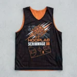 Black and orange reversible basketball pinnie, black front.