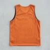 Black and orange reversible basketball pinnie, orange back.