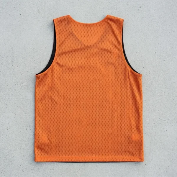 Black and orange reversible basketball pinnie, orange back.
