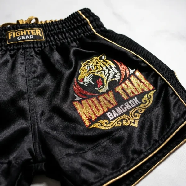 Black glitter heat transfer muay thai shorts.