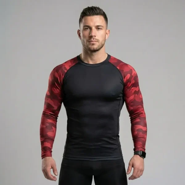 Long sleeve compression rash guard featuring a solid black torso panel paired with red camouflage raglan sleeves.