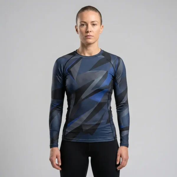 Women's compression fit rash guard designed with a tailored ergonomic silhouette and flexible flatlock seams.