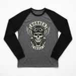 A long-sleeve raglan shirt with contrasting sleeves, printed with a bold skull bobber, highlighting sleeve detail.