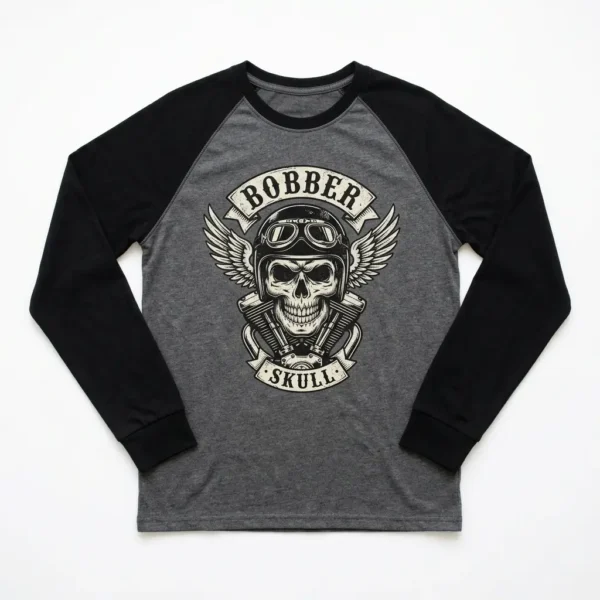 A long-sleeve raglan shirt with contrasting sleeves, printed with a bold skull bobber, highlighting sleeve detail.