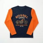 An embroidered motorcycle garage t-shirt with orange long sleeves.
