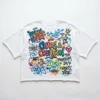 White graffiti cropped oversized t-shirt front.