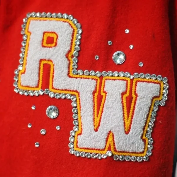 Chenille embroidery with rhinestones.
